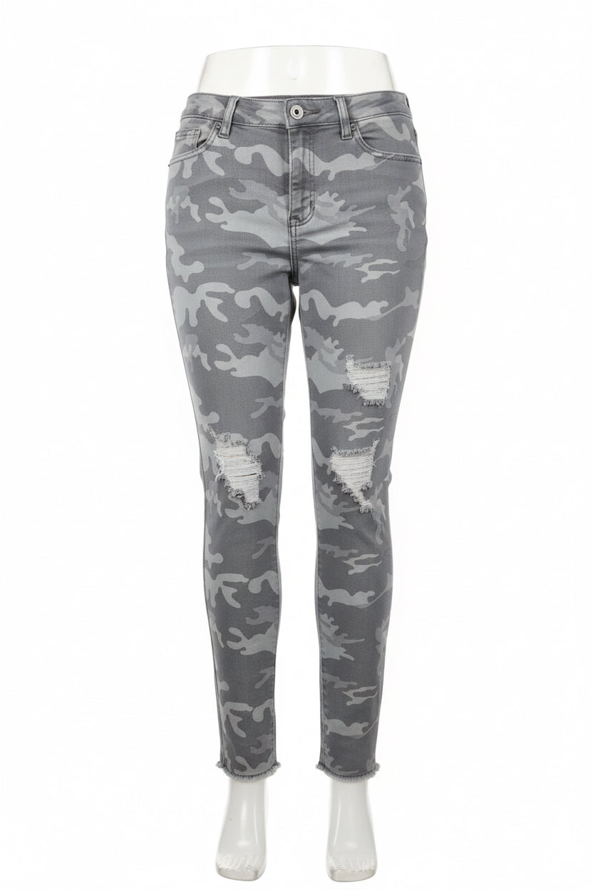Front view of gray distressed camouflage pants with ripped detailing and frayed hems on mannequin